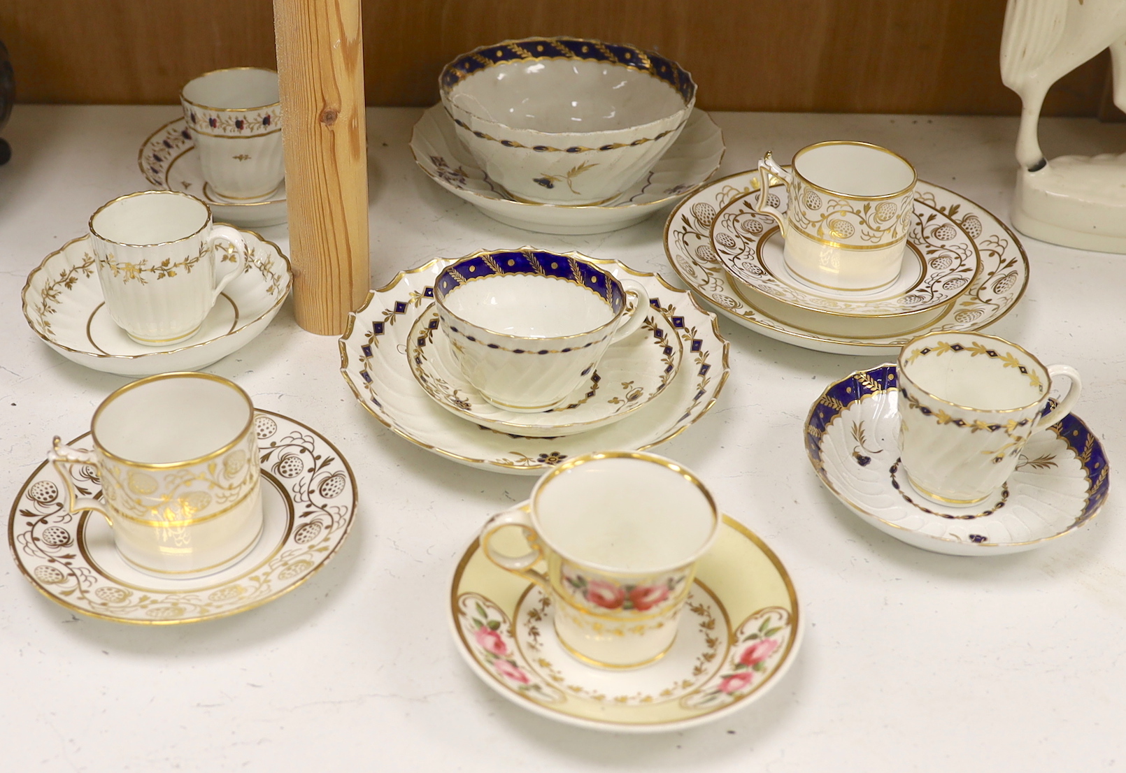 Two Flight Barr and Barr coffee can and matching saucer dish with gilded strawberries, four Flight cups and saucers, two Flight saucer dishes and a bowl together with a Chamberlain coffee can and saucer, bowl 15cm diamet